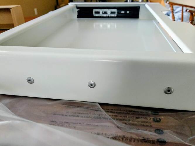 Fastened by three pop rivets?