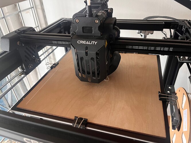 a sheet of laser cut 1/8 inch plywood on a 3d printer bed